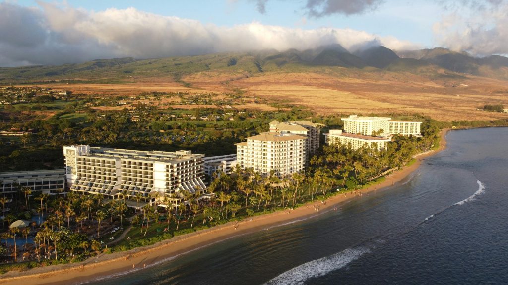 Scenic aerial view of resort hotels along Kaanapali Beach, Maui at sunset.