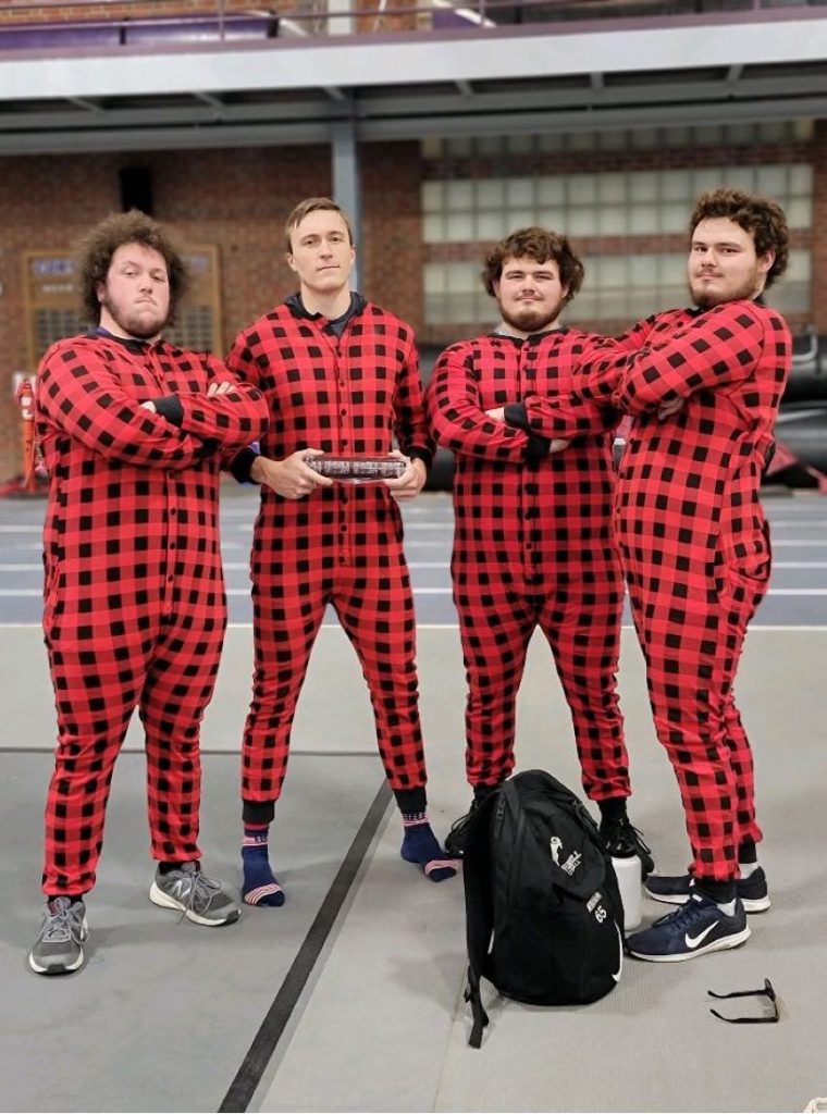 Brevin Hahn and Nathan Watters, in onesie uniforms with the Corley twins.