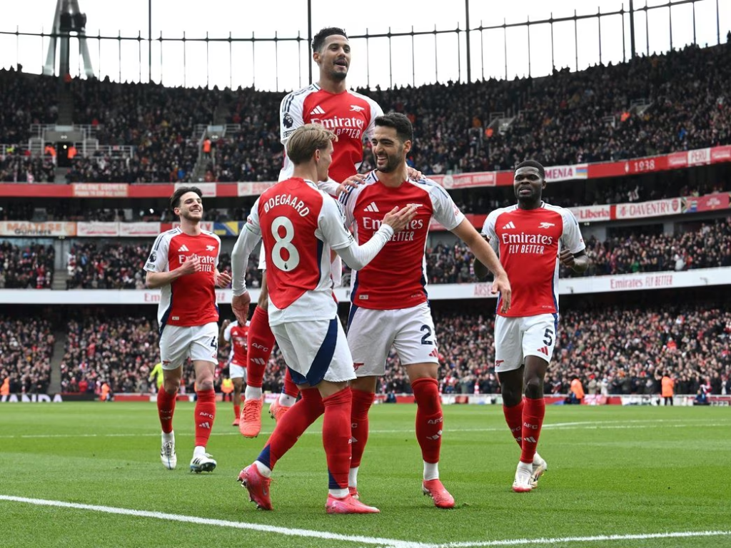 Arsenal's players celebrate yet another set-piece goal.